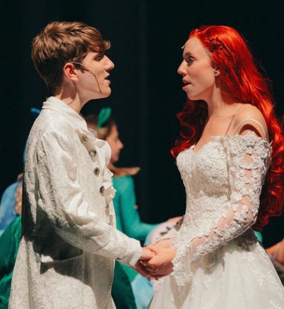  Peyton Seyler and Mars Woelfel on stage as Prince Eric and Ariel